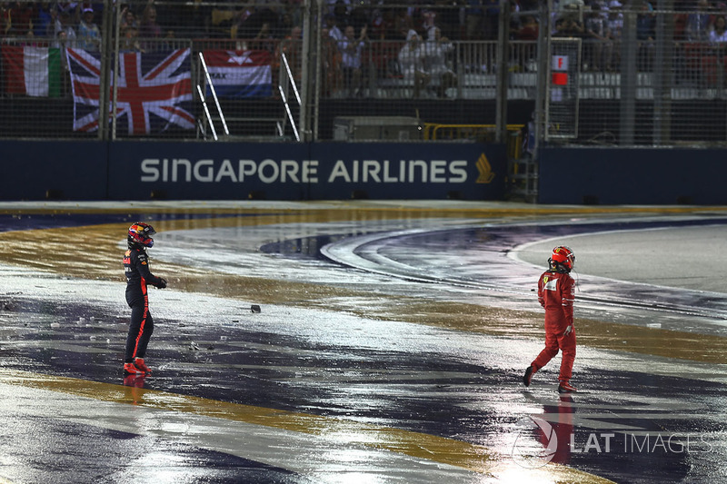 Kimi Raikkonen, Ferrari and Max Verstappen, Red Bull Racing walk in after crashing at race start