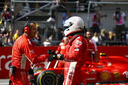 Sebastian Vettel, Ferrari, is congratulated on his third place finish