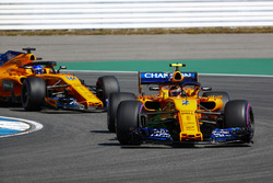 Stoffel Vandoorne, McLaren MCL33, leads Fernando Alonso, McLaren MCL33