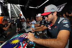 Carlos Sainz Jr., Scuderia Toro Rosso signs autographs for the fans