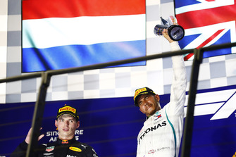 Max Verstappen, Red Bull Racing, and Lewis Hamilton, Mercedes AMG F1, celebrate on the podium