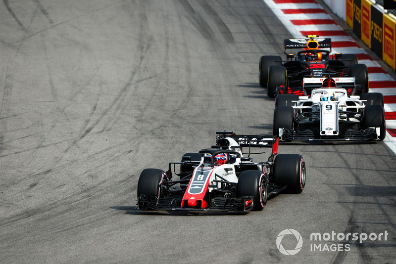 Romain Grosjean, Haas F1 Team VF-18, leads Marcus Ericsson, Sauber C37, and Max Verstappen, Red Bull Racing RB14