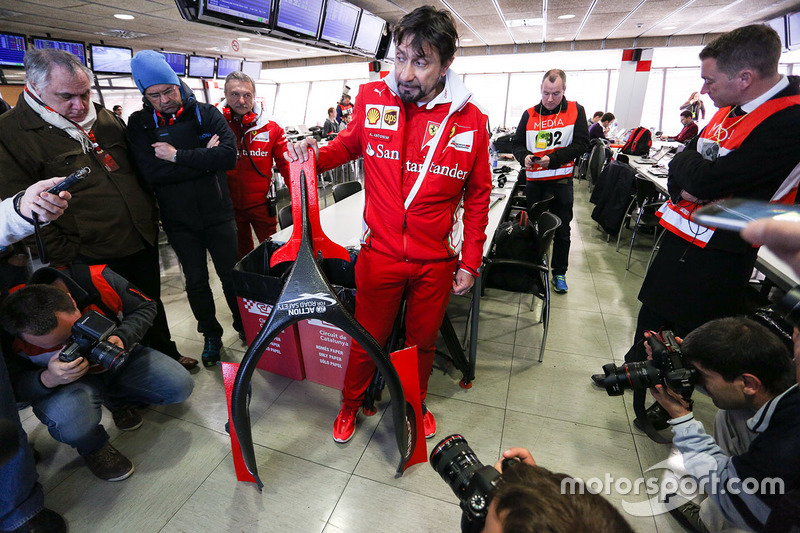 Alberto Antonini, Ferrari Press Officer discusses the Halo cockpit cover to the media