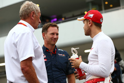 (L to R): Dr Helmut Marko, Red Bull Motorsport Consultant with Christian Horner, Red Bull Racing Team Principal and Sebastian Vettel, Ferrari
