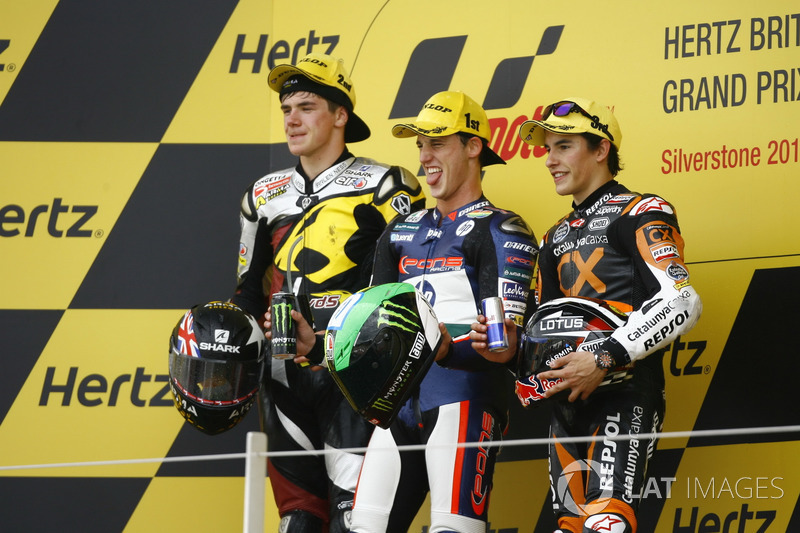 Podio: segundo lugar Scott Redding, ganador de la carrera Pol Espargaró, tercer lugar Marc Márquez