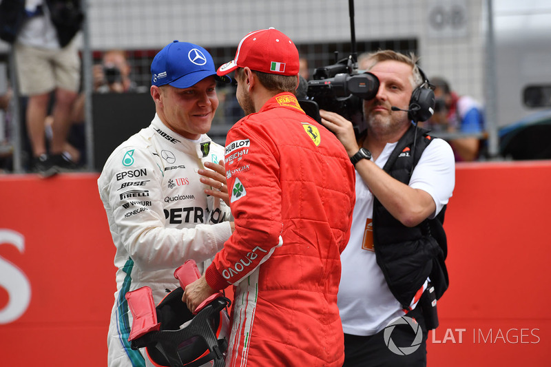 Pole sitter Valtteri Bottas, Mercedes-AMG F1 and third place Sebastian Vettel, Ferrari celebrate in parc ferme