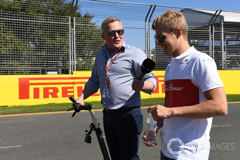 Marcus Ericsson, Alfa Romeo Sauber F1 Team walks the track and talks with Johnny Herbert, Sky TV