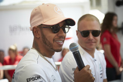 Lewis Hamilton, Mercedes AMG F1, and Valtteri Bottas, Mercedes AMG F1 on stage