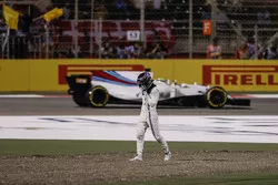 Lance Stroll, Williams FW40, walks away from his damaged car after a collision with Carlos Sainz Jr., Scuderia Toro Rosso