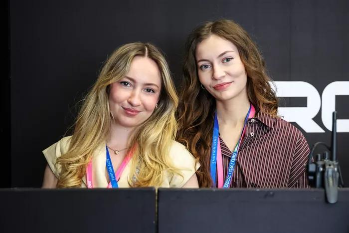 Olivia Hartley and Hannah Atkinson pose for a photo in the CUPRA KIRO garage 