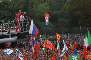 Second place Kimi Raikkonen, Ferrari celebrates on the podium with Felipe Massa 