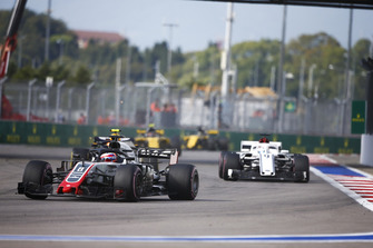 Romain Grosjean, Haas F1 Team VF-18, leads Marcus Ericsson, Sauber C37