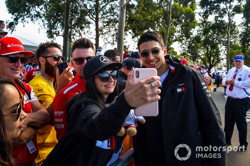 Esteban Ocon, Mercedes AMG F1 poses for a selfie with a fan.