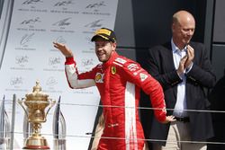 Race winner Sebastian Vettel, Ferrari celebrates on the podium