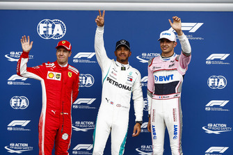 Sebastian Vettel, Ferrari, with Esteban Ocon, Racing Point Force India VJM1, and pole sitter Lewis Hamilton, Mercedes AMG F1