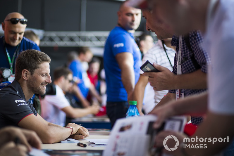 Romain Grosjean, Haas F1 Team signs autographs