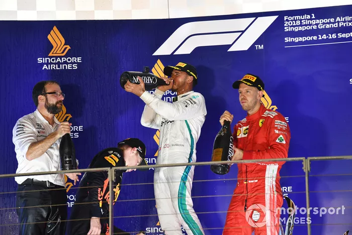 Max Verstappen, Red Bull Racing, Lewis Hamilton, Mercedes AMG F1 and Sebastian Vettel, Ferrari celebrate on the podium with the champagne 