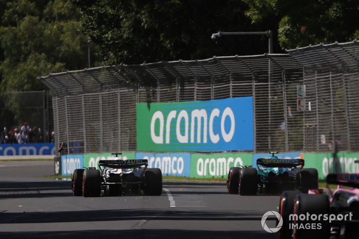 Nyck de Vries, AlphaTauri AT04, leads Fernando Alonso, Aston Martin AMR23, and Esteban Ocon, Alpine A523
