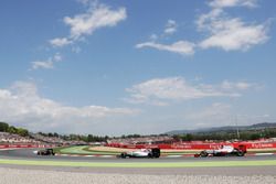 Fernando Alonso, McLaren MP4-31 leads Felipe Massa, Williams FW38 and Romain Grosjean, Haas F1 Team 