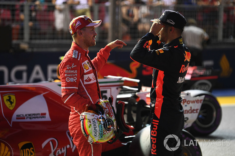 Pole sitter Sebastian Vettel, Ferrari and Daniel Ricciardo, Red Bull Racing in parc ferme