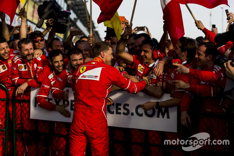 Sebastian Vettel, Ferrari, 1st Position, celebrates in Parc Ferme with his team