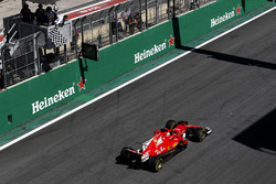 Sebastian Vettel, Ferrari SF70H crosses the line to take the chequered flag and win the race