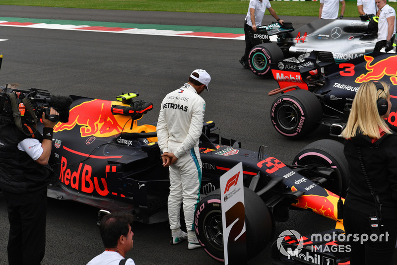 Lewis Hamilton, Mercedes AMG F1 looks at Red Bull Racing RB14 in Parc Ferme 