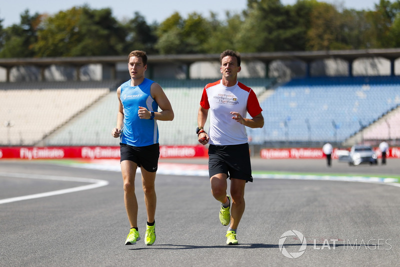 Stoffel Vandoorne, McLaren, jogs the circuit with a fitness trainer