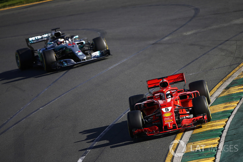 Sebastian Vettel, Ferrari SF71H, leads Lewis Hamilton, Mercedes AMG F1 W09