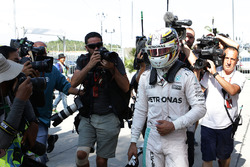 Lewis Hamilton, Mercedes AMG F1 returns to the pits after he retired from the race