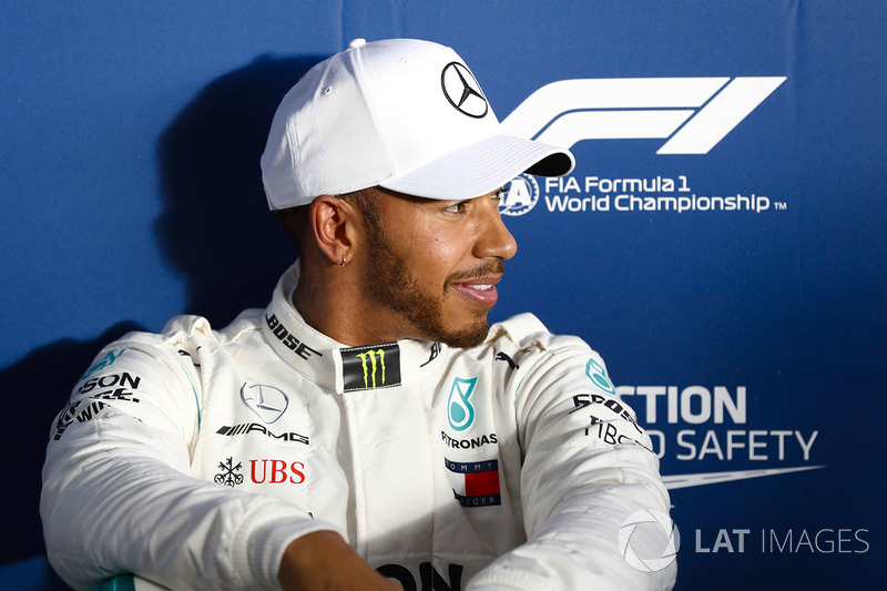 Lewis Hamilton, Mercedes AMG F1, relaxes after setting pole position