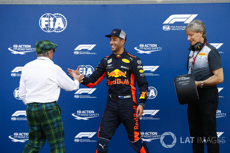 Daniel Ricciardo, Red Bull Racing, receives the Pirelli pole position trophy from Sir Jackie Stewart