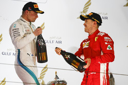 Valtteri Bottas, Mercedes AMG F1, 2nd position, and Sebastian Vettel, Ferrari, 1st position, celebra