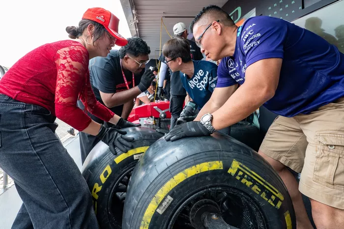 Fans taking part in pit stop challenge