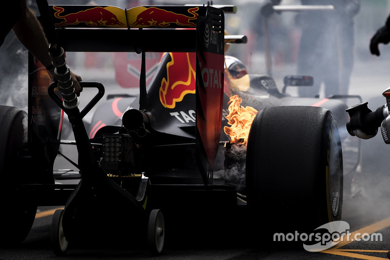 The brakes of Max Verstappen, Red Bull Racing RB12, catch fire in the pits