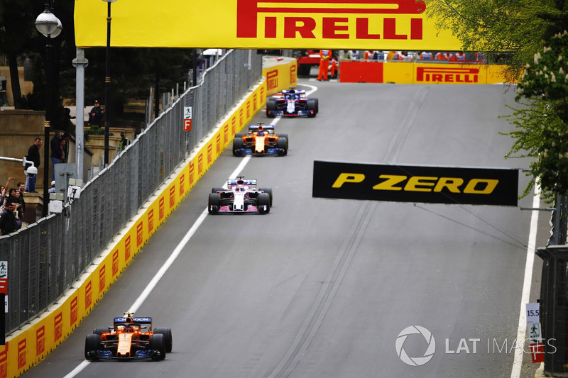 Stoffel Vandoorne, McLaren MCL33 Renault, leads Sergio Perez, Force India VJM11 Mercedes, and Fernando Alonso, McLaren MCL33 Renault