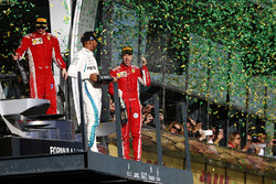 Kimi Raikkonen, Ferrari, 3rd position, Lewis Hamilton, Mercedes AMG F1, 2nd position, and Sebastian