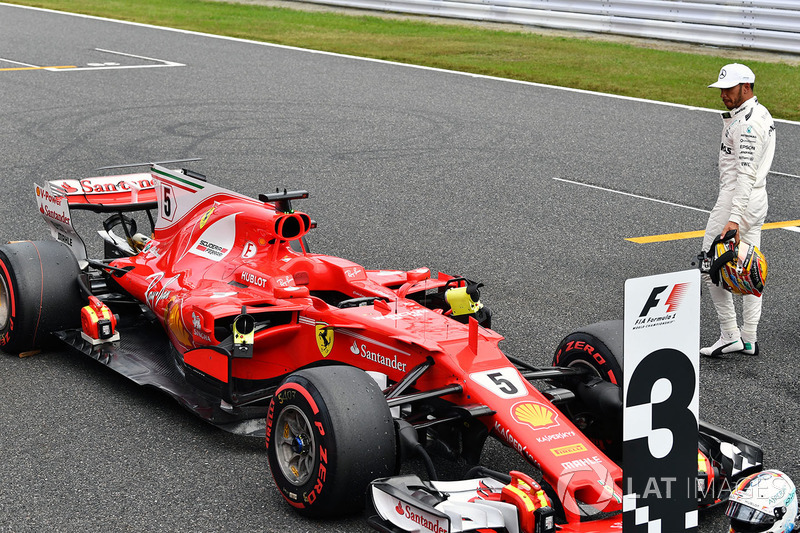 Lewis Hamilton, Mercedes AMG F1 looks at the Ferrari SF70H in parc ferme