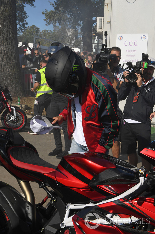 Lewis Hamilton, Mercedes AMG F1 arrives at the track on his motorbike