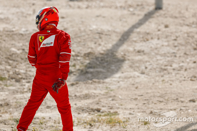 Kimi Raikkonen, Ferrari, heads back to the Ferrari garage