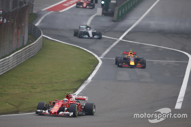 Kimi Raikkonen, Ferrari SF70H, leads Max Verstappen, Red Bull Racing RB13, and Valtteri Bottas, Mercedes AMG F1 W08, out of the pits