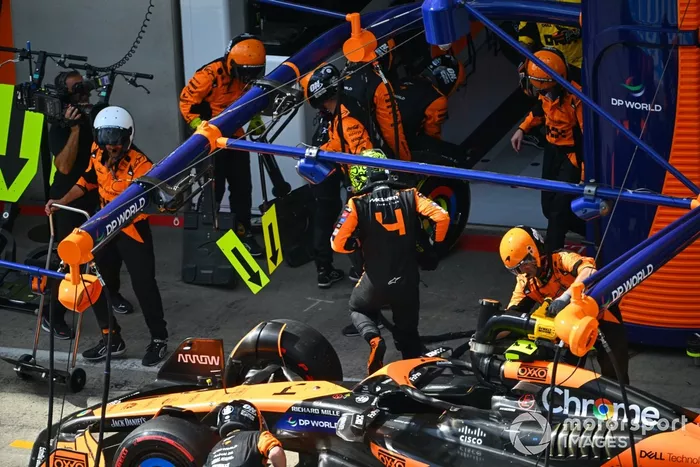 Lando Norris, McLaren MCL38, retires in the pits after contact with Max Verstappen, Red Bull Racing RB20, whilst battling for the lead