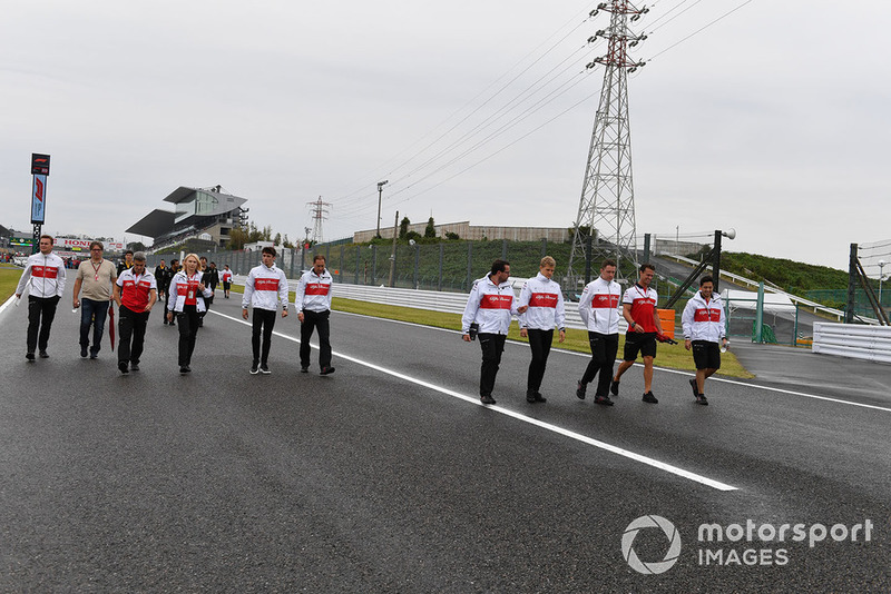 Charles Leclerc, Sauber and Marcus Ericsson, Sauber walk the track