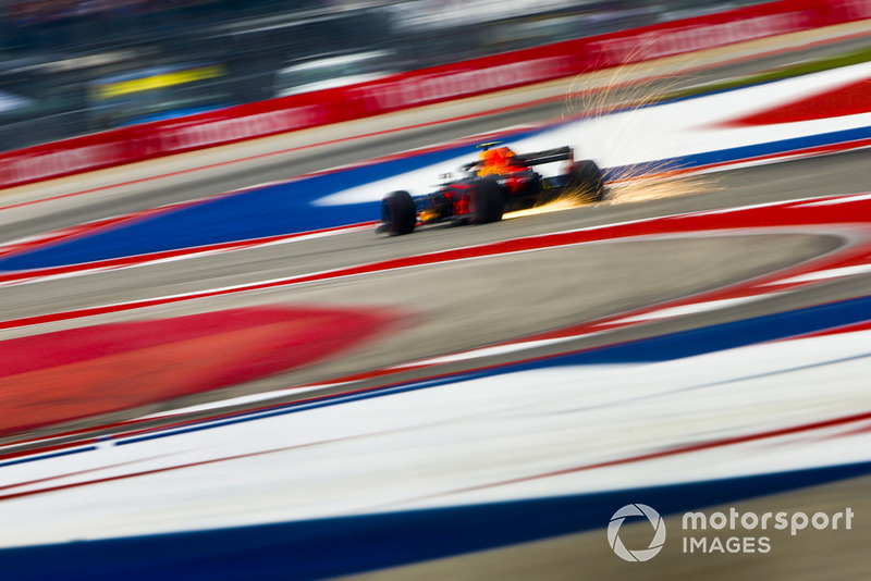 Sparks fly from the rear of Max Verstappen, Red Bull Racing RB14