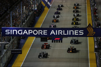 Lewis Hamilton, Mercedes AMG F1 W09 EQ Power+, leads Max Verstappen, Red Bull Racing RB14, and the rest of the field away at the start