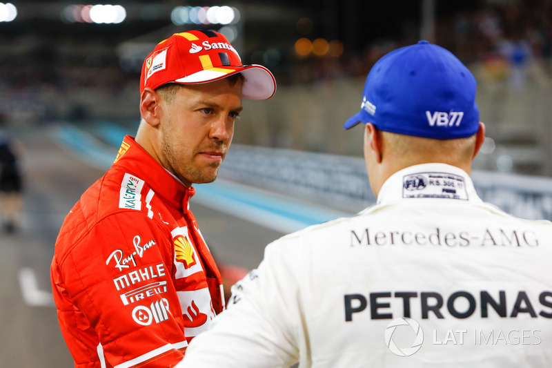 Sebastian Vettel, Ferrari, with Valtteri Bottas, Mercedes AMG F1