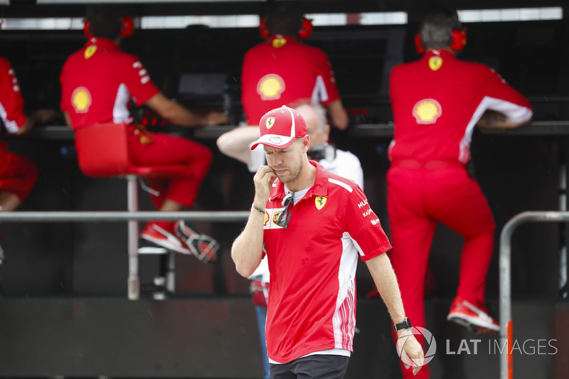 After crashing out, Sebastian Vettel, Ferrari, talks to Maurizio Arrivabene, Team Principal, Ferrari, and Jock Clear, Engineering Director, Ferrari