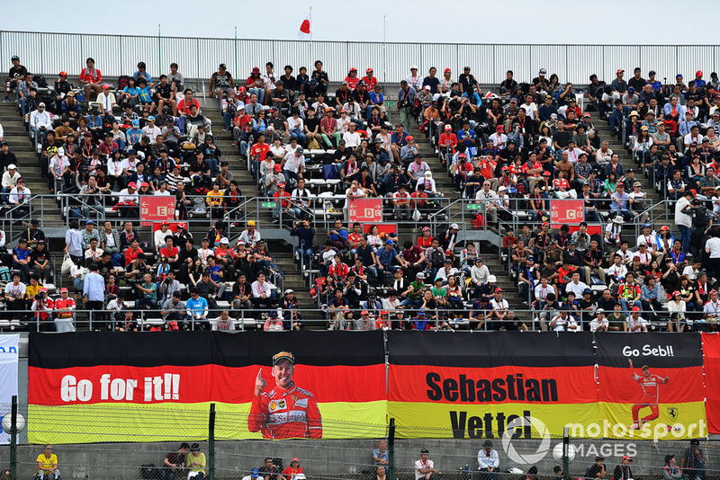 Sebastian Vettel, Ferrari fans and banners