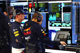 Max Verstappen, Red Bull Racing, studies the data in the garage with his team.