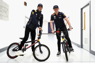 Max Verstappen, Red Bull Racing and Daniel Ricciardo, Red Bull Racing ride bikes in the factory